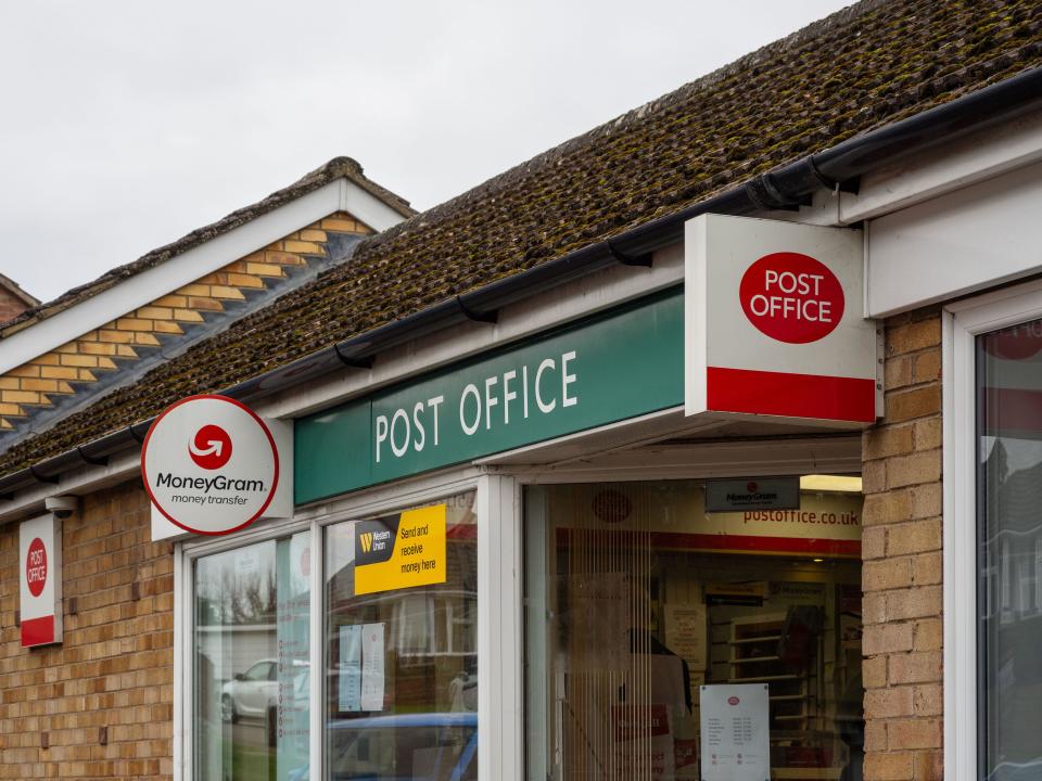 Exterior of a sub post office in the village of Hardingstone, Northampton, UK