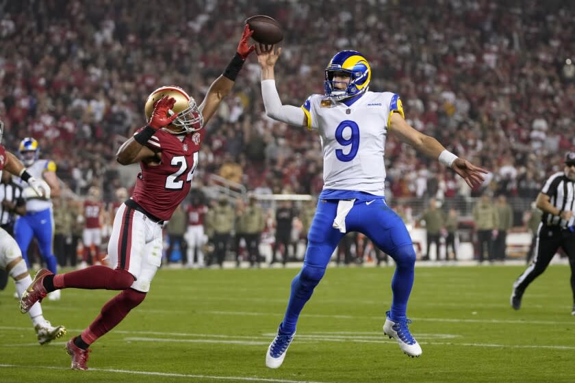 Los Angeles Rams quarterback Matthew Stafford (9) passes as San Francisco 49ers defensive back K'Waun Williams (24) applies pressure during the second half of an NFL football game in Santa Clara, Calif., Monday, Nov. 15, 2021. (AP Photo/Tony Avelar)