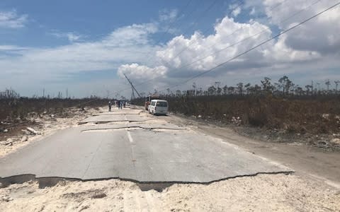 Road asphalt on the Grand Bahama Highway torn up by 220 mph winds - Credit: Hayley Dixon for the Telegraph