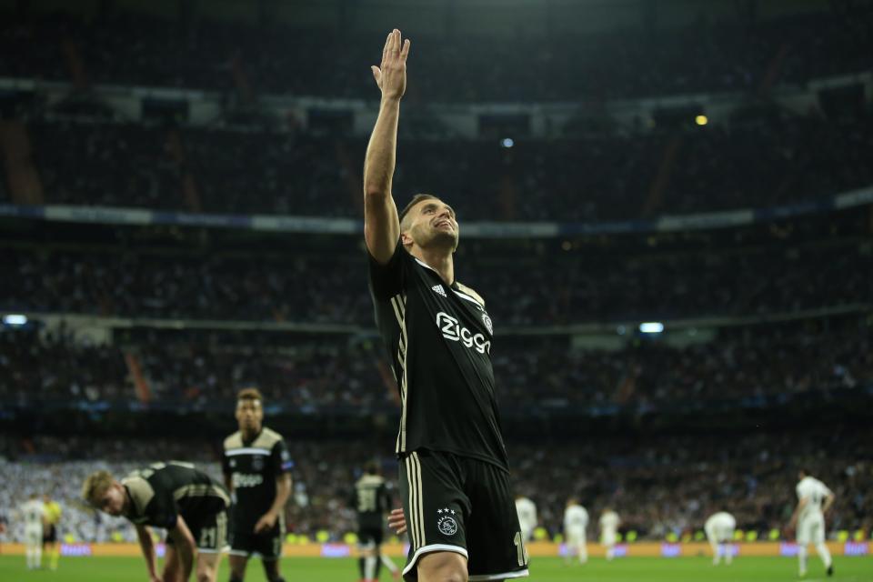 Ajax's Dusan Tadic celebrates after scoring his side's third goal during the Champions League round of 16 second leg soccer match between Real Madrid and Ajax at the Santiago Bernabeu stadium in Madrid, Tuesday, March 5, 2019. (AP Photo/Bernat Armangue)