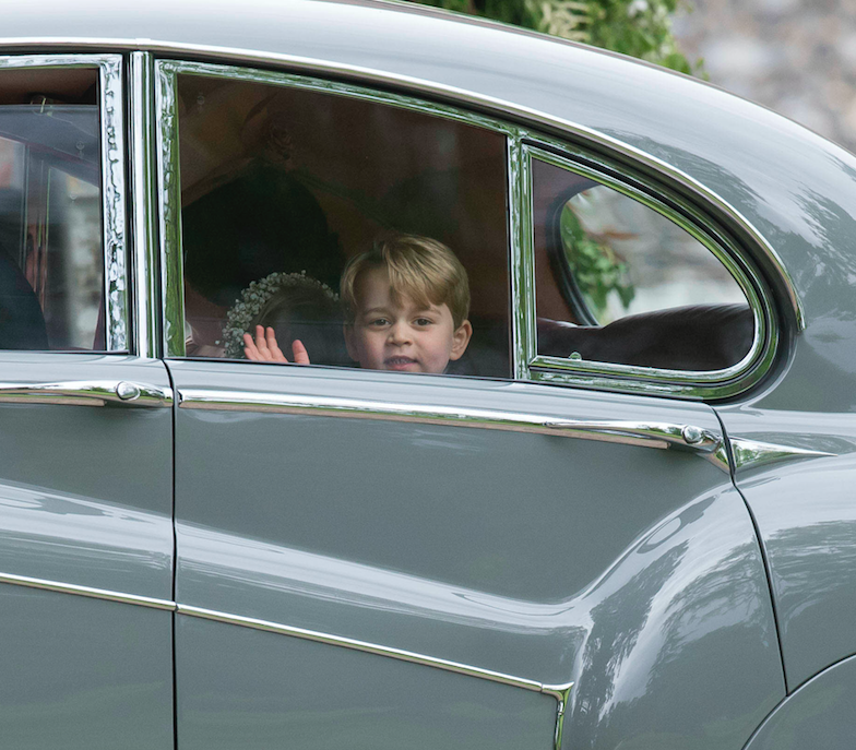 Prince George eventually perked up and smiled for the cameras. Photo: AP