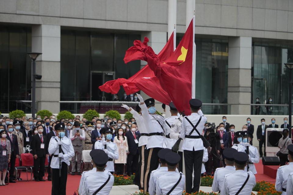 A flag raising ceremony is held at the Golden Bauhinia Square for the celebration of 24th anniversary of Hong Kong handover to China, in Hong Kong, Thursday, July 1, 2021. (AP Photo/Kin Cheung)