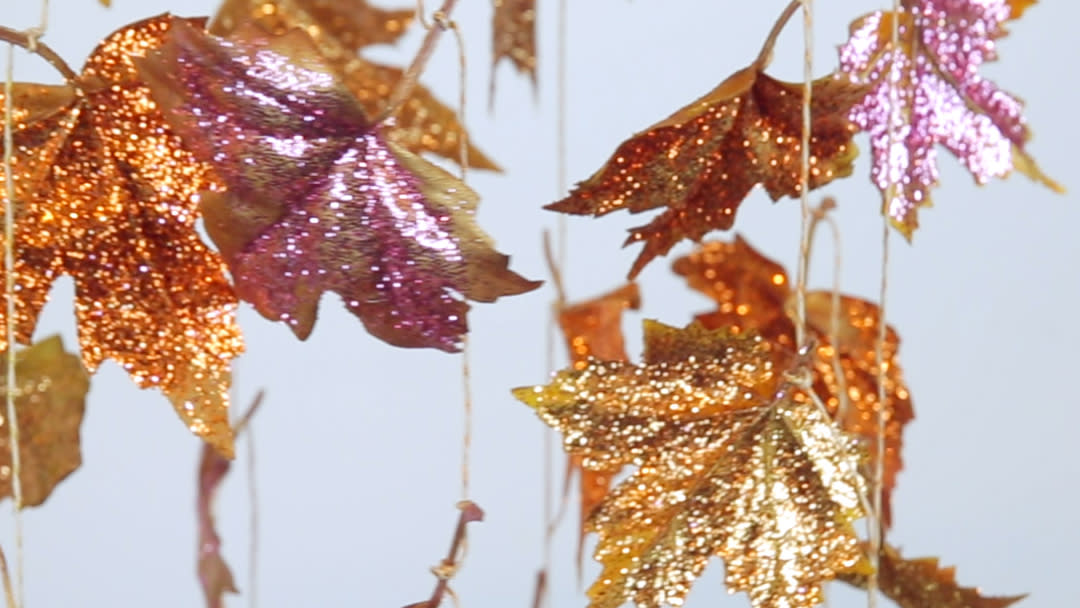 Hang this glitter leaves chandelier in your home for the sparkliest Thanksgiving ever