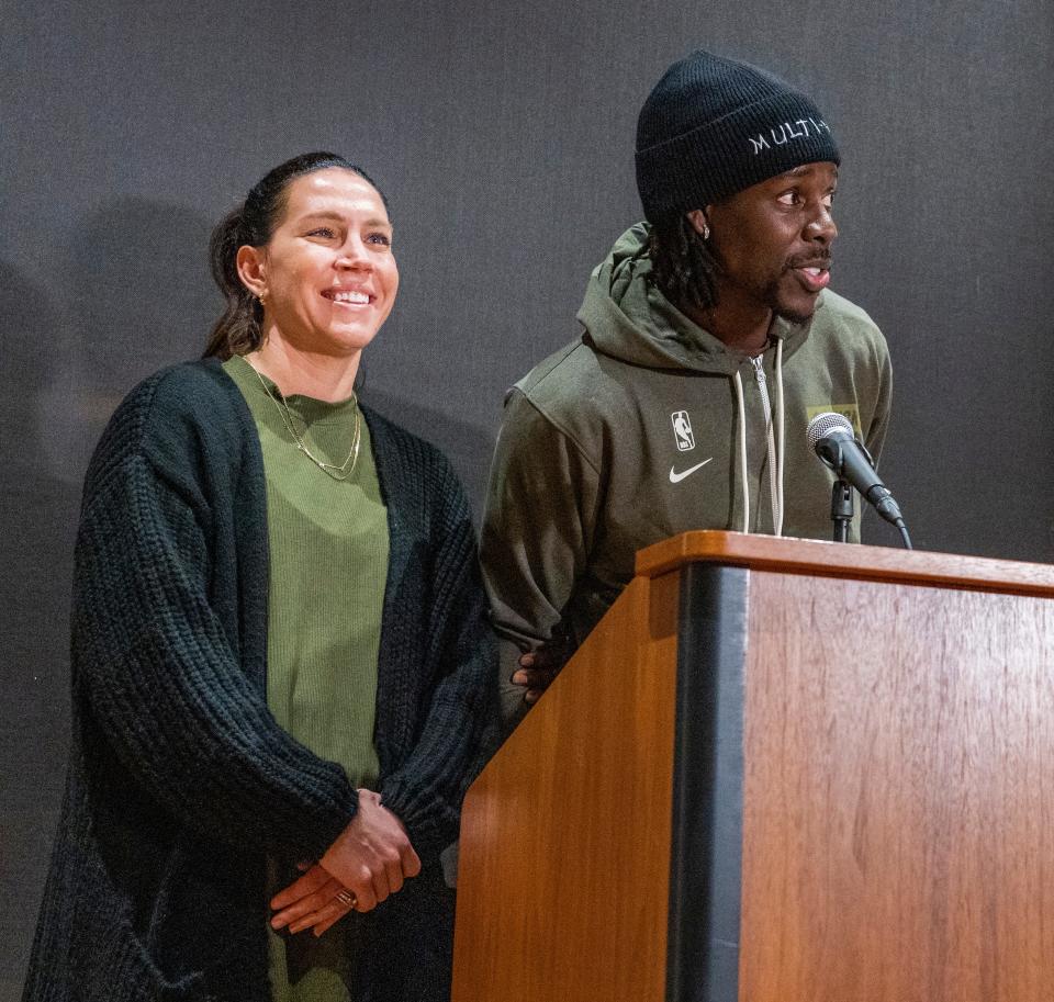 Lauren and Jrue Holiday speak at a news conference Friday at Sojourner Family Peace Center, where they teamed up with the Milwaukee Bucks Foundation and Kohler Co. to update local shelter baths and shower rooms in Milwaukee.