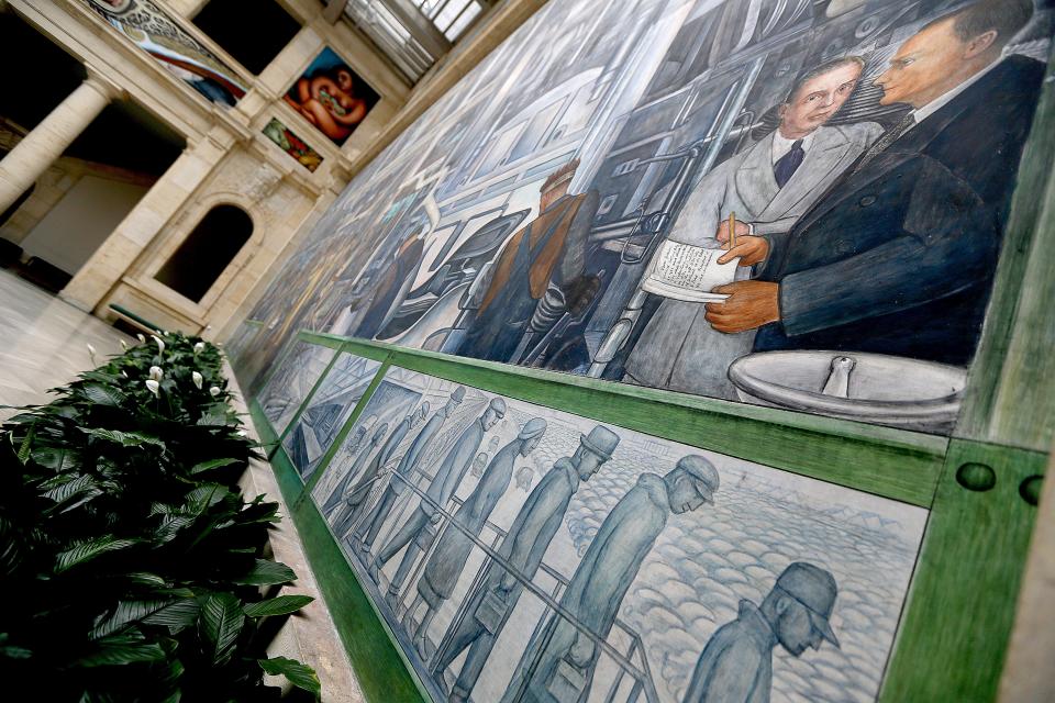 This view of the "Detroit Industry Murals" shows Edsel B. Ford, who gifted the frescoes to the DIA and institute director at the time Dr. W. R. Valentiner.