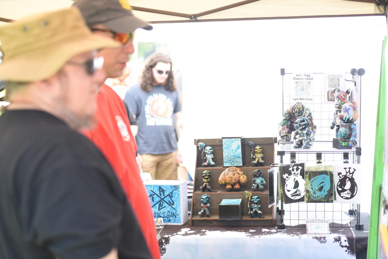 Kyle Irving, an artist from Detroit, sells art pieces and figurines he makes himself at Frankenfest