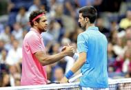 Sep 6, 2016; New York, NY, USA; Jo-Wilfried Tsonga of France shakes hands with Novak Djokovic of Serbia after the match on day nine of the 2016 U.S. Open tennis tournament at USTA Billie Jean King National Tennis Center. Mandatory Credit: Jerry Lai-USA TODAY Sports