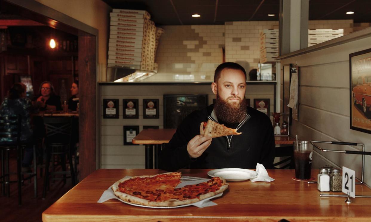 <span>Kenny Wildes: ‘A colleague chuckled and said: “I bet you couldn’t eat pizza every day for a week.” I rose to the challenge.’</span><span>Photograph: Tony Luong/The Guardian</span>