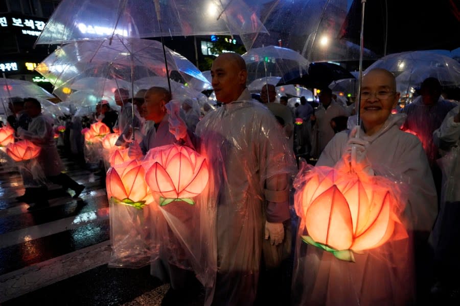 Buddhist monks walk in a lantern parade during the Lotus Lantern Festival, ahead of the birthday of Buddha at Dongguk University in Seoul, South Korea, Saturday, May 11, 2024. (AP Photo/Ahn Young-joon)