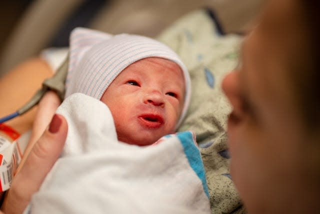 Sarah Abraham looks at her son Paxton. His eyes were intense, like staring into his soul, she says.