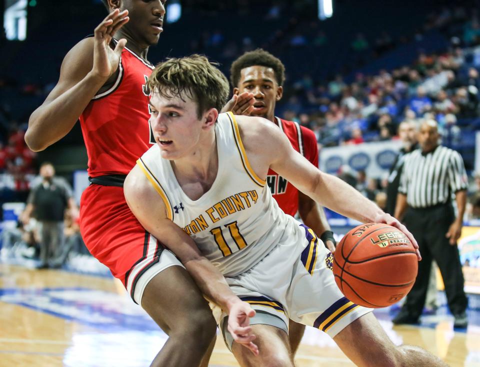 Lyon County's Travis Perry looks to drive against the John Hardin defense. The Lyons beat the Bulldogs 82-65 win over John Hardin in Thursday's Boys Sweet 16 tournament. March 17, 2022