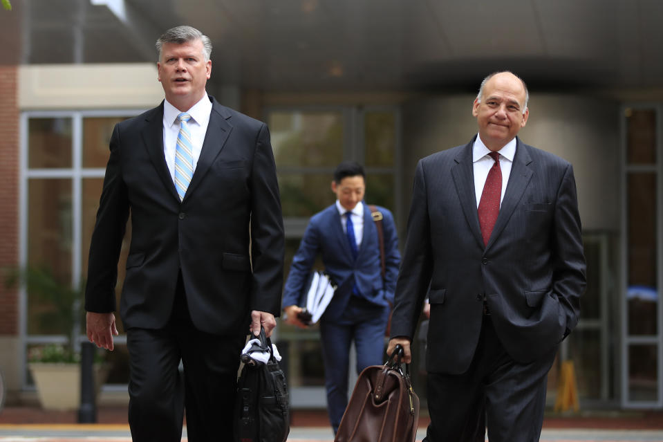Kevin Downing, left, and Thomas Zehnle, attorneys for Paul Manafort, walk to the Alexandria Federal Courthouse in Alexandria, Va., Friday, Aug. 3, 2018, on day four of President Donald Trump's former campaign chairman Paul Manafort's tax evasion and bank fraud trial. (AP Photo/Manuel Balce Ceneta)