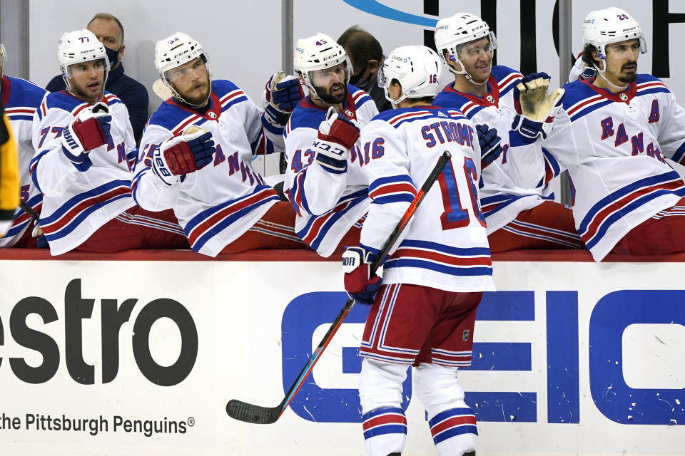 New York Rangers' Ryan Strome (16) returns to the bench after scoring during the second period of an NHL hockey game against the Pittsburgh Penguins in Pittsburgh, Sunday, Jan. 24, 2021. (AP Photo/Gene J. Puskar)