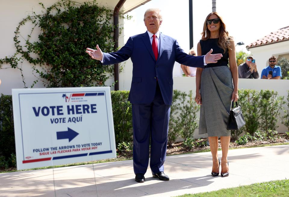 Trump speaks to reporters after voting in the midterms in Palm Beach, Florida, on Tuesday 8 November (Getty Images)