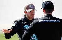 TALLADEGA, AL - OCTOBER 22: Scott Speed, driver of the #46 Red Line Oil Ford, speaks with Josh Wise, driver of the #37 Bradley University Ford, during qualifying for the NASCAR Sprint Cup Series Good Sam Club 500 at Talladega Superspeedway on October 22, 2011 in Talladega, Alabama. (Photo by Jeff Zelevansky/Getty Images for NASCAR)