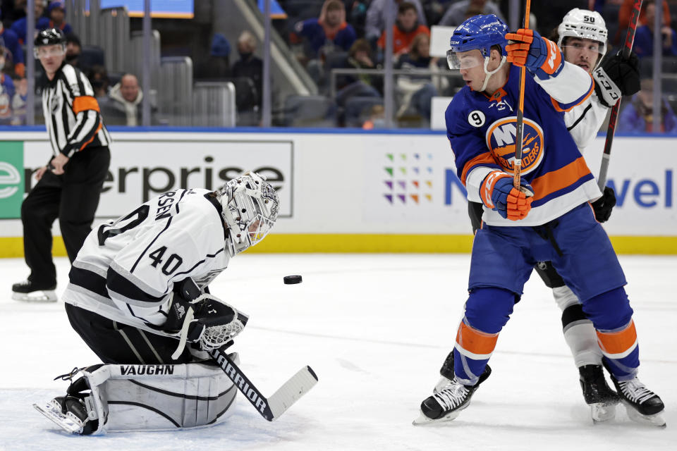 Los Angeles Kings goaltender Cal Petersen makes a save in front of New York Islanders left wing Anthony Beauvillier in the second period of an NHL hockey game Thursday, Jan. 27, 2022, in Elmont, N.Y. (AP Photo/Adam Hunger)