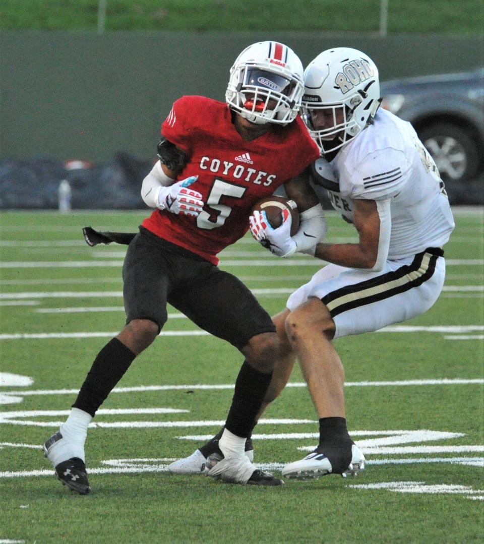 Wichita Falls High's Jae'Den Williams battles Rider's Jacob Cahill on Friday, August 26, 2022 at Memorial Stadium.