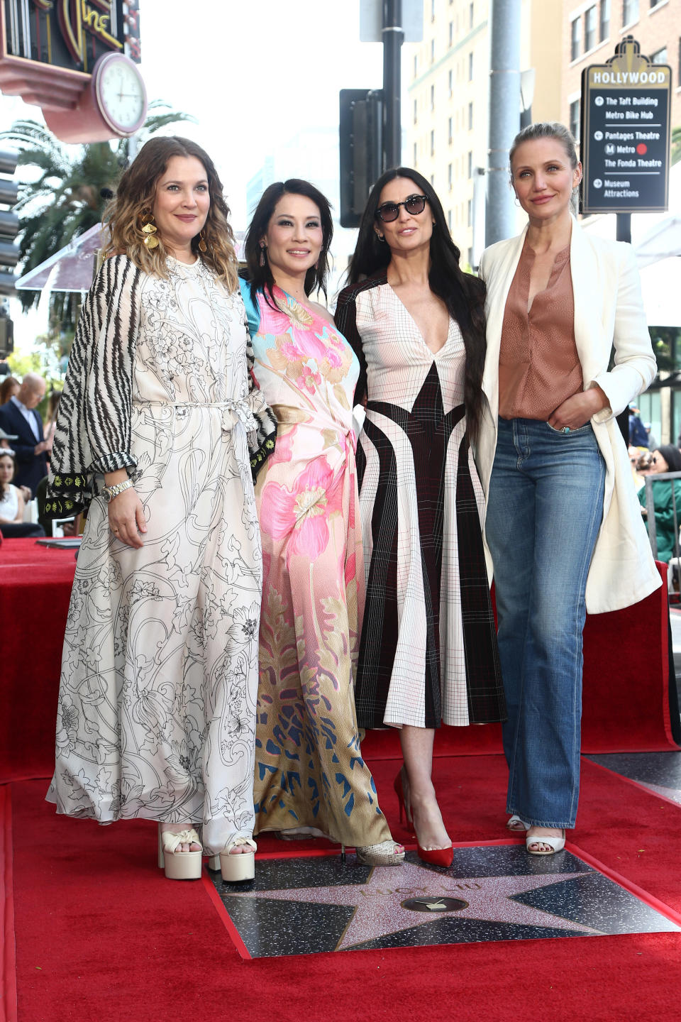 The Charlie's Angels trio posed with former co-star Demi Moore. (Photo: Getty images) 