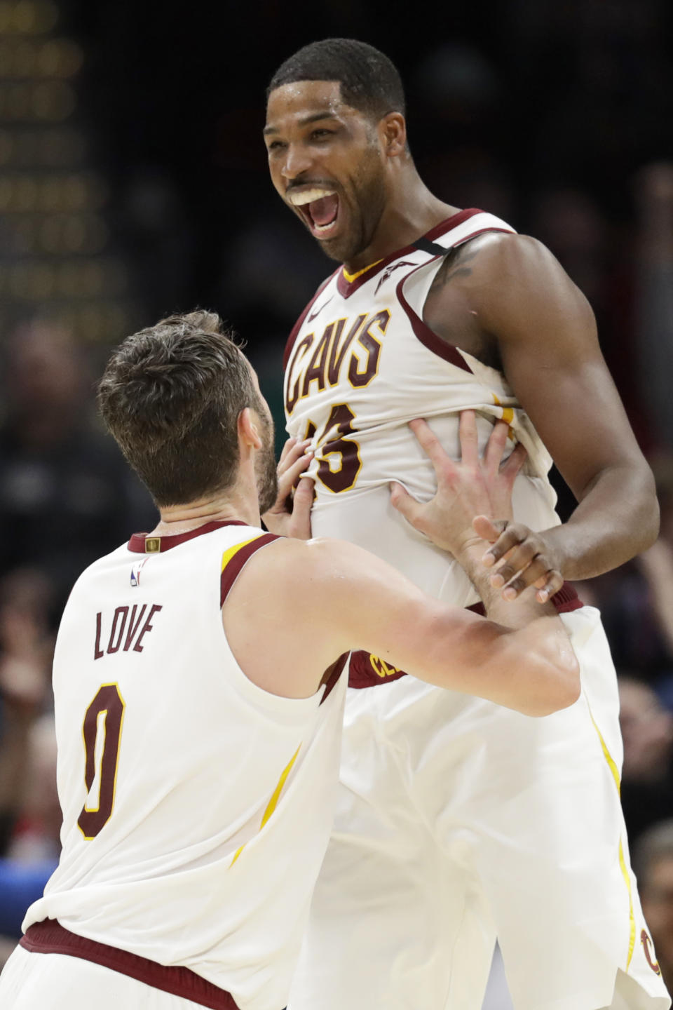 Cleveland Cavaliers' Tristan Thompson (13) and Kevin Love (0) celebrate after they defeated the Miami Heat in overtime in an NBA basketball game, Monday, Feb. 24, 2020, in Cleveland. (AP Photo/Tony Dejak)