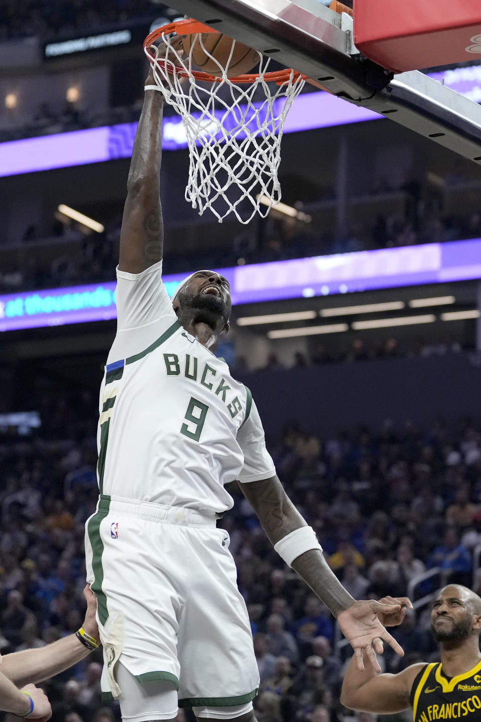 Milwaukee Bucks forward Bobby Portis dunks against the Golden State Warriors during the first half of an NBA basketball game in San Francisco, Wednesday, March 6, 2024. (AP Photo/Jeff Chiu)