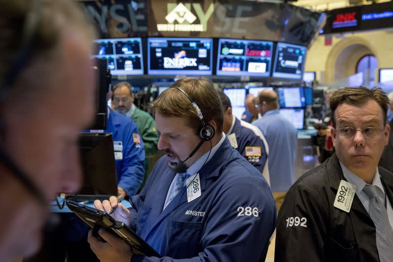 Traders work on the floor of the New York Stock Exchange July 28, 2015. REUTERS/Brendan McDermid