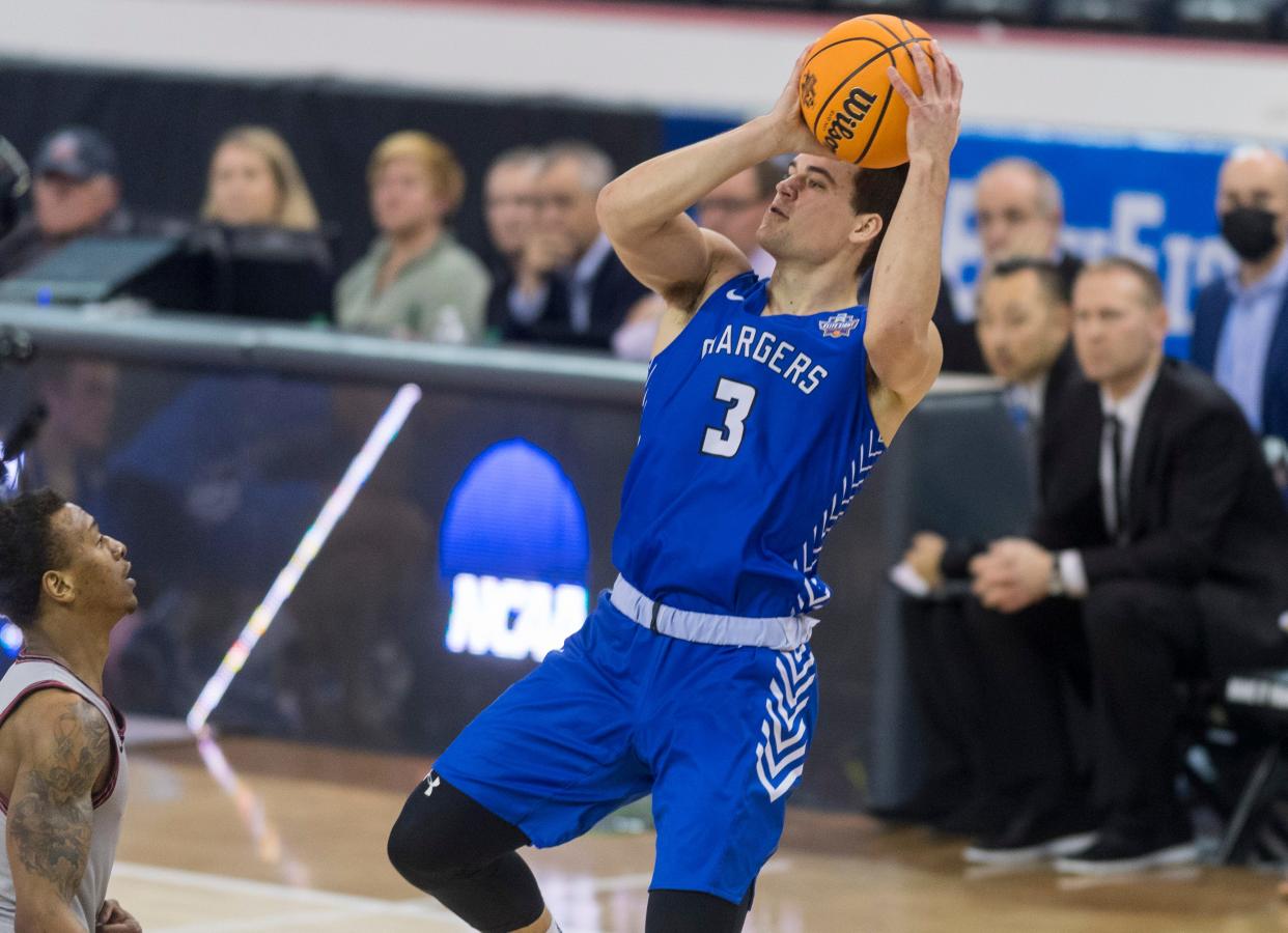 Hillsdale's Jack Gohlke (3) takes a shot as the Hillsdale College Chargers play the Indiana University of Pennsylvania Crimson Hawks during their NCAA Division II men's basketball Elite Eight quarterfinals game at Ford Center in Evansville, Ind., Tuesday afternoon, March 22, 2022. Indiana University of Pennsylvania beat Hillsdale College, 67-55. 