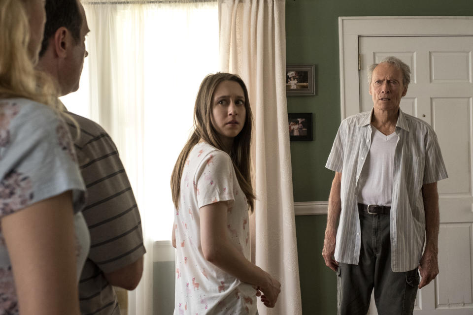 This image released by Warner Bros. Pictures shows Taissa Farmiga, center, and Clint Eastwood in a scene from "The Mule." (Claire Folger/Warner Bros. Pictures via AP)