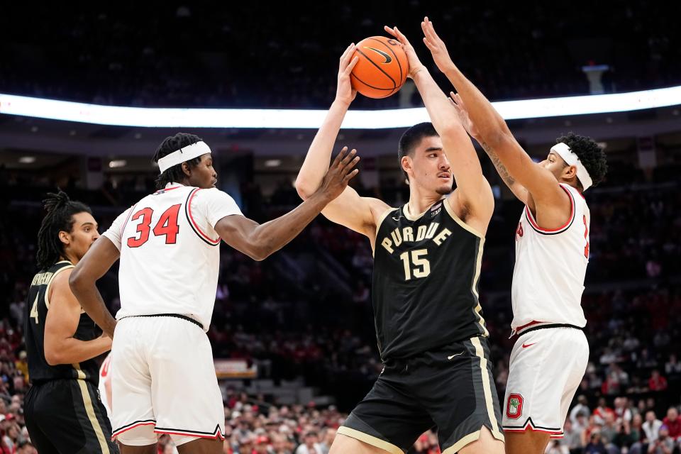 Feb 18, 2024; Columbus, Ohio, USA; Ohio State Buckeyes center Felix Okpara (34) and forward Caleb Furst (1) guard Purdue Boilermakers center Zach Edey (15) during the first half of the NCAA men’s basketball game at Value City Arena.