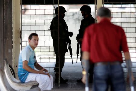 Marines patrol a polling station during municipal elections in Sao Luis, Brazil, October 2, 2016. REUTERS/Ueslei Marcelino