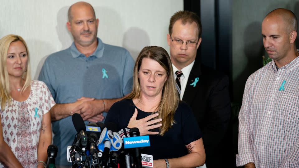 Nichole Schmidt, mother of Gabby Petito, speaks alongside, from left, Tara Petito, Petito's stepmother; Joseph Petito, her father; Richard Stafford, the family's attorney; and Jim Schmidt, her stepfather; during a news conference in September 2021 in Bohemia, New York. - John Minchillo/AP