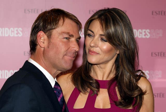 Shane Warne and Elizabeth Hurley at a photocall for Estee Lauder as part of Breast Cancer Awareness Month at Selfridges in London in 2012