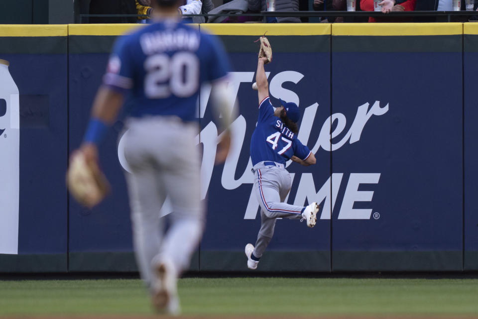 Texas Rangers right fielder Josh H. Smith cannot make the catch on a double by Seattle Mariners' Tom Murphy during the third inning of a baseball game Tuesday, May 9, 2023, in Seattle. (AP Photo/Stephen Brashear)