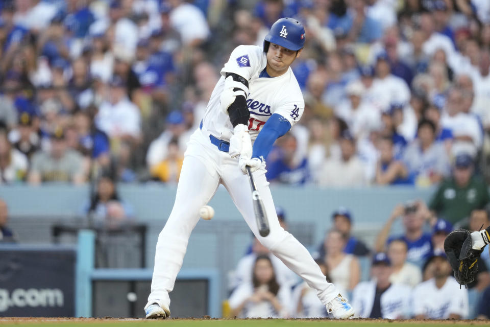 Los Angeles Dodgers' Shohei Ohtani grounds out during the third inning in Game 2 of a baseball NL Division Series against the San Diego Padres, Sunday, Oct. 6, 2024, in Los Angeles. (AP Photo/Ashley Landis)