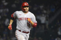 Cincinnati Reds' Joey Votto rounds the bases after hitting a two-run home run off Chicago Cubs relief pitcher Cory Abbott during the ninth inning of a baseball game Wednesday, July 28, 2021, in Chicago. (AP Photo/Charles Rex Arbogast)