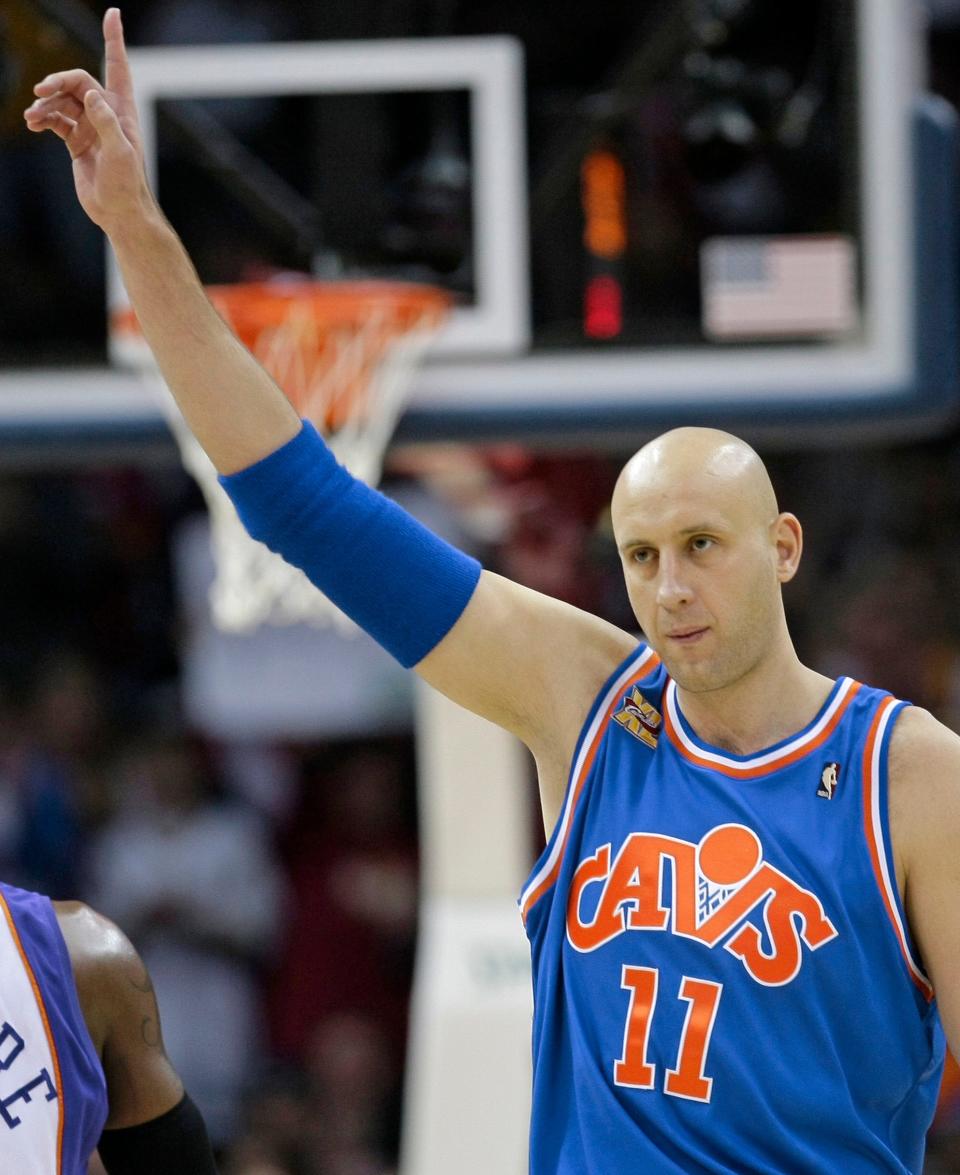 In this Dec. 2, 2009, file photo, Cleveland Cavaliers' Zydrunas Ilgauskas, of Lithuania, acknowledges the crowd while entering an NBA basketball game against the Phoenix Suns in Cleveland.