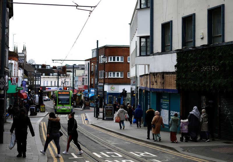 People walk along a high street in Croydon