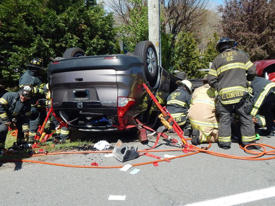 A Honda overturned after colliding nearly head-on with a Ram and struck a utility pole before coming to rest off the roadway on Friday, police said.