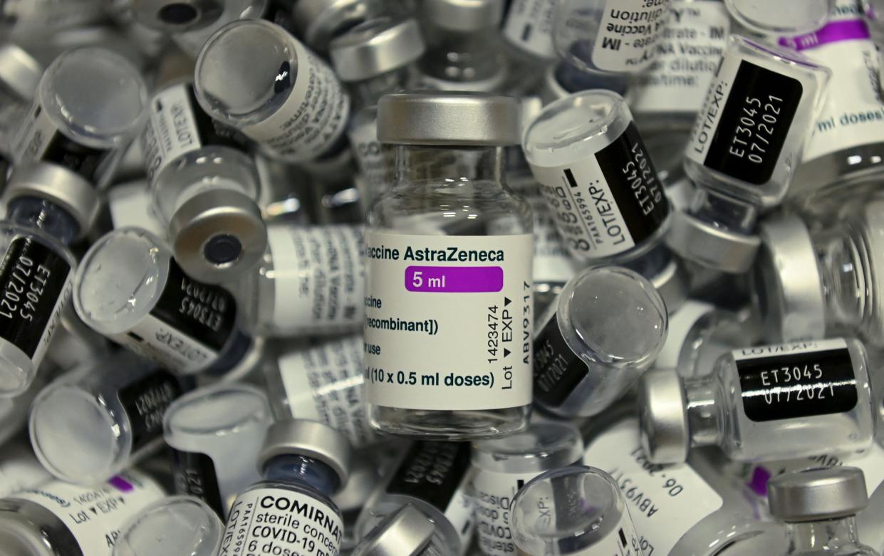 Empty vials of vaccines by Pfizer-BioNTech and AstraZeneca against Covid-19 caused by the novel coronavirus are pictured at the vaccination center in Rosenheim, southern Germany, on April 20, amid the novel coronavirus / COVID-19 pandemic. 