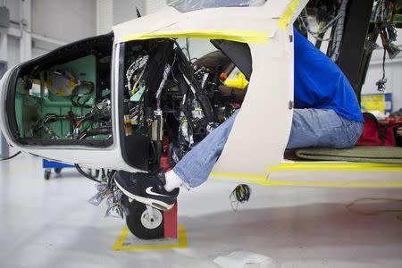 File photo of an aircraft technician assembles an S-76D helicopter at Sikorsky Global Helicopters in Coatesville, Pennsylvania October 16, 2014. REUTERS/Mark Makela