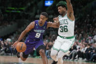 Charlotte Hornets guard Theo Maledon (9) tries to drive past Boston Celtics guard Marcus Smart (36) during the second half of an NBA basketball game, Monday, Nov. 28, 2022, in Boston. (AP Photo/Steven Senne)