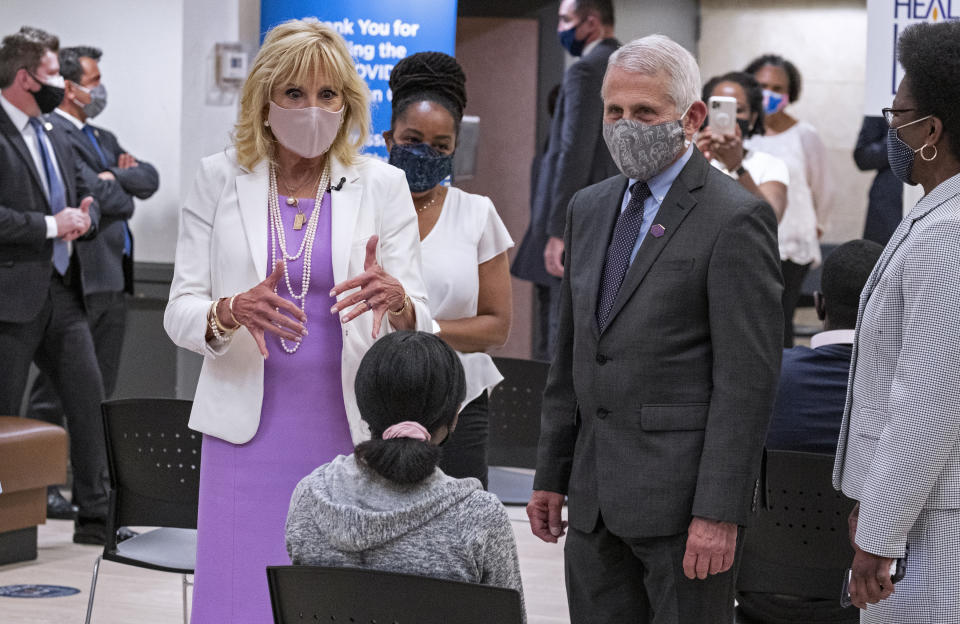 FILE - First lady Jill Biden, center left, and Dr. Anthony Fauci, director of the National Institute of Allergy and Infectious Diseases, speak to a person as they visit a vaccine clinic at the Abyssinian Baptist Church in the Harlem neighborhood of New York on June 6, 2021. (AP Photo/Craig Ruttle, File)