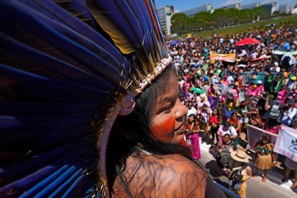 Guajajara speaks from the top of a sound car to Indigenous women from across Brazil gathering for a march at the end of a three-day event to strengthen the political role of Indigenous women in Brasília, Brazil, Wednesday, Sept. 13, 2023.