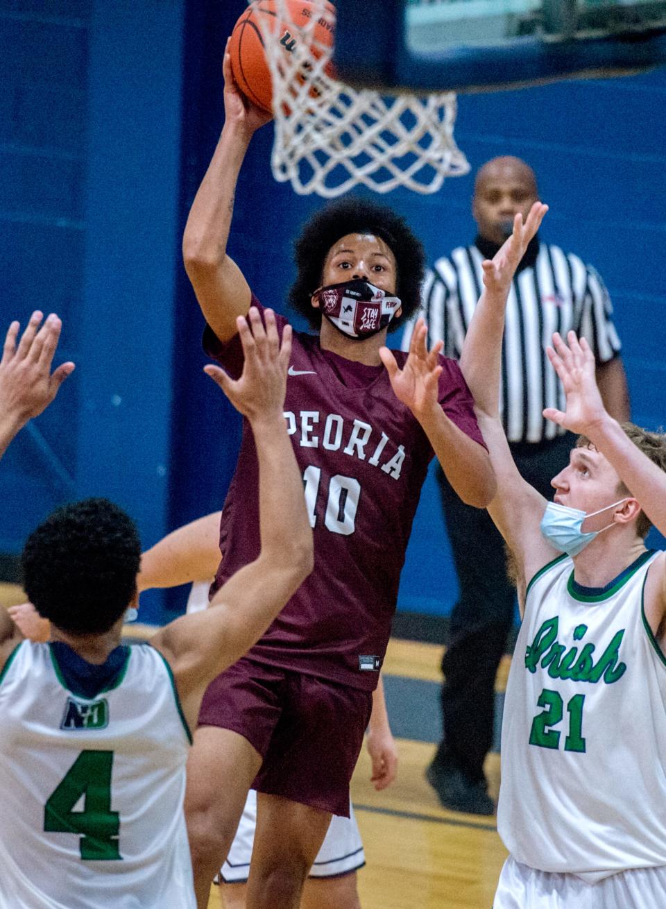 Limestone's De'Kwon Brown (10) puts up a shot last season for Peoria High. The sophomore point guard has blossomed into a college prospect in his first season with the Rockets.