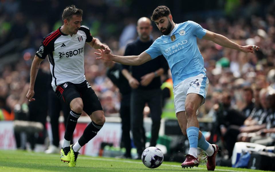 Fulham's Timothy Castagne in action with Manchester City's Josko Gvardiol