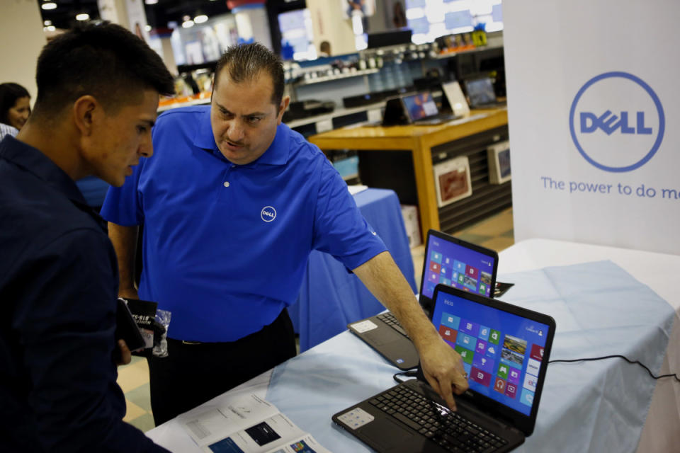 A Dell employee demonstrates features on an Inspiron 15 laptop during an event at a Curacao department store in Los Angeles on Wednesday, Aug. 7, 2013. Patrick T. Fallon/Bloomberg via Getty Images<p>Bloomberg/Getty Images</p>