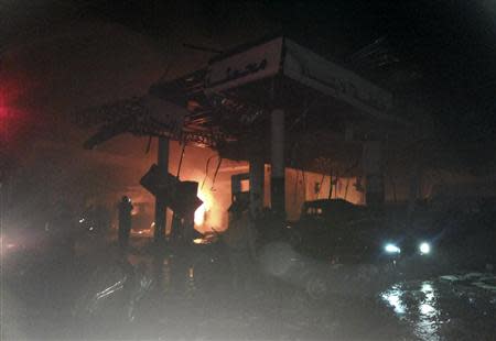 A damaged petrol station is seen at the site of an explosion in the Shi'ite town of Hermel February 1, 2014. REUTERS/Rami Bleibel