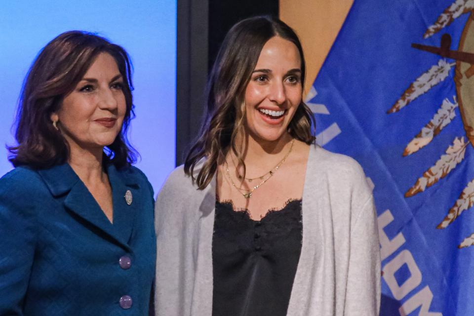 Kelsee Arnold stands on stage at the Oklahoma History Center with state schools Superintendent Joy Hofmeister on Wednesday, Oct. 12, 2022, in Oklahoma City. Arnold, a third- through fifth-grade gifted and talented teacher in Broken Arrow Public Schools, was announced as a finalist for 2023 Oklahoma Teacher of the Year.