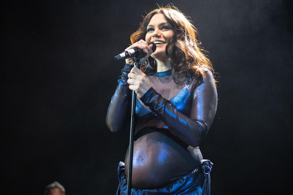 <p>A pregnant <a href="https://people.com/tag/jessie-j/" rel="nofollow noopener" target="_blank" data-ylk="slk:Jessie J;elm:context_link;itc:0;sec:content-canvas" class="link ">Jessie J</a> glimmers under the spotlight during her Feb. 27 performance at the O2 Shepherd's Bush Empire in London. </p>