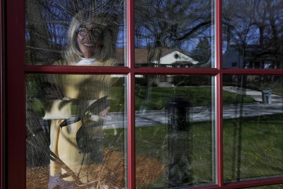 Jody Garrison is seen inside her home Wednesday May 13, 2020, in Milwaukee. Two months into the crisis, millions of Americans are struggling to cope with the fallout, whether it's losing loved ones, losing a job or staying at home more than they ever have. Among those grappling with the new dynamics is Garrison, who works from her Milwaukee home, turning old books into journals and selling them online. It's the rare trip to the grocery store — or to the auto mechanic shop later this week to pick up her car after a repair — that brings on the anxiety. “You worry about, ‘Am I going to catch something from touching something?’ so I truly don't go out in public much at all,” she said by telephone. (AP Photo/Morry Gash)