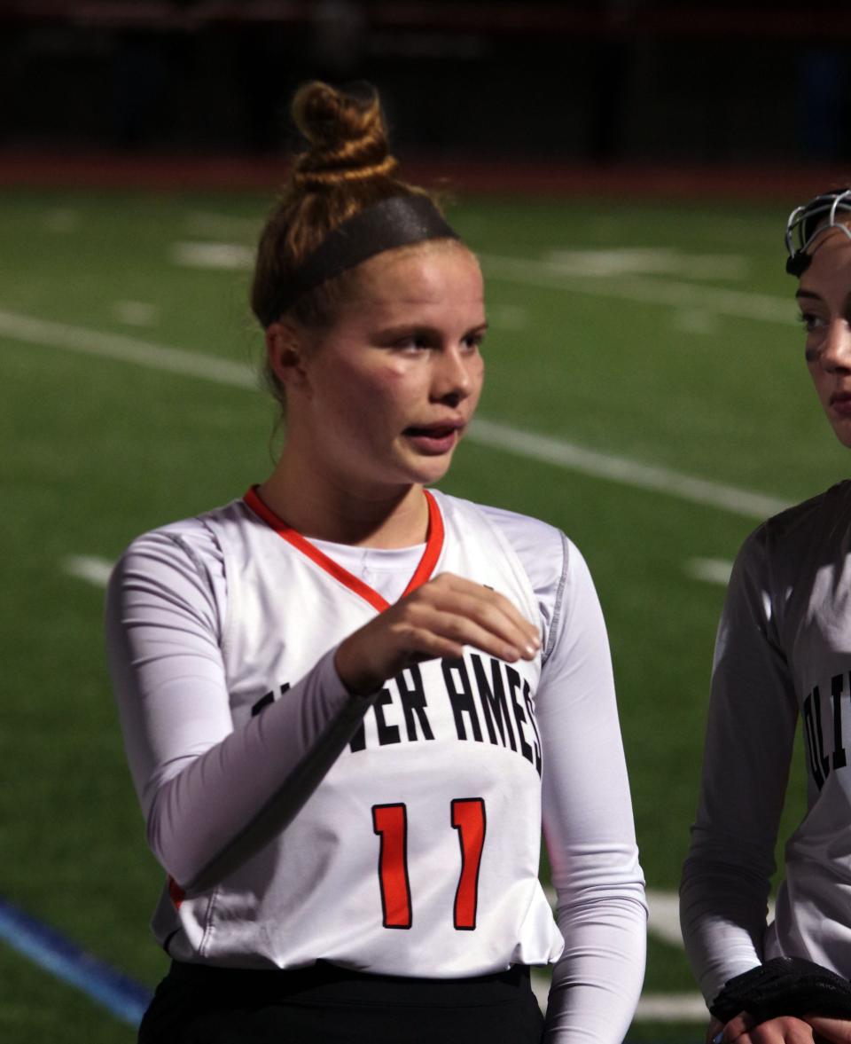 Thursday, Nov. 4, 2021 -- Oliver Ames forward Georgia Costello talks strategy with her teammates during a break in the second half of the field hockey playoff game with Scituate, while down 1-0.